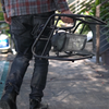 Man carrying 1500 Watt infrared space heater for tradesmen, outdoor, or patio.